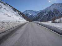 Snowy Road Through the Alps: A Winter Landscape in Switzerland