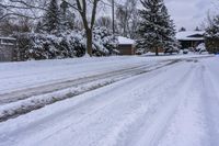 a snowy sidewalk with a stop sign on it in the middle of a neighborhood,