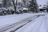 a snowy sidewalk with a stop sign on it in the middle of a neighborhood,