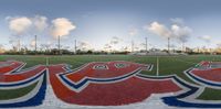 a soccer field with a painted out letters in it for a new team field design