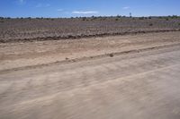 South African Desert: Barren Terrain and Endless Road