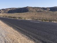 there is a sign in the middle of a desert road to remind someone who's missing