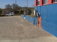 a white truck that is parked near some buildings in front of it and an orange door