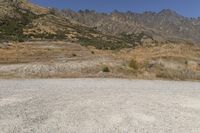 South Island Dirt Road: Surrounded by Majestic Mountains