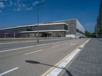 the empty road is surrounded by buildings in the city area of a very nice place