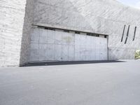 A Building in Spain: Concrete Walls and Asphalt Surfaces