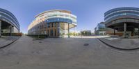 two fish eye panoramic shots showing the buildings in front of each other and on the road