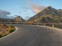 Spain: Curved Road at Dawn with Armco Barriers