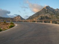 Spain: Curved Road at Dawn with Armco Barriers