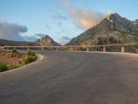 Spain: Curved Road at Dawn with Armco Barriers