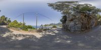 this fisheye image shows a bend where you can see the road to the beach