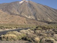 Spain's Highland: Hills and an Asphalt Road with Clear Sky