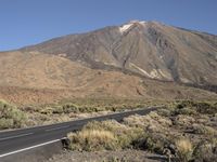 Spain's Highland: Hills and an Asphalt Road with Clear Sky