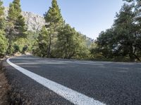 there is an arrow pointing down a mountain road as if to follow an arrow to its destination