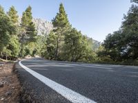 there is an arrow pointing down a mountain road as if to follow an arrow to its destination