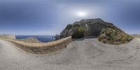 an image of a big rock on the side of a road in italy and there is no image here to provide a caption