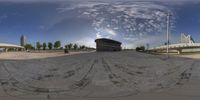 a view from a 360 - eye lens is shown of an empty road and city buildings