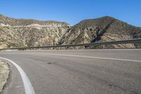 Spanish Coastal Road with Clear Skies Over the Ocean