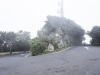 A Winding Mountain Road in Spain: Cutting Through the Fog