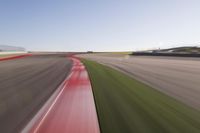 a speed motion on an empty track with a car coming toward the corner, taken from a camera