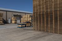 stacks of wooden pallets are parked at the warehouse near other pallets in pallets