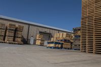 stacks of wooden pallets are parked at the warehouse near other pallets in pallets