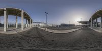 a panoramic view looking at the stadium from inside of it, of a half - pipe