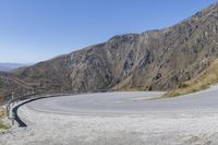 the curve on this winding road is very steep and unsubstructed from a mountain pass