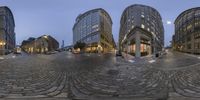 two fisheye glasses of an upside down building, in the city of stockholm, sweden