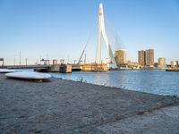 there is a stone bench that has been placed by the water in front of it