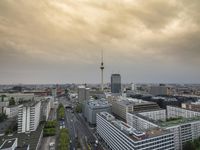 an aerial view of traffic along the busy streets of the city during a stormy day