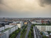 an aerial view of traffic along the busy streets of the city during a stormy day