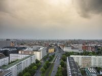 an aerial view of traffic along the busy streets of the city during a stormy day