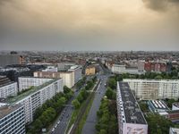 an aerial view of traffic along the busy streets of the city during a stormy day