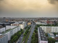 an aerial view of traffic along the busy streets of the city during a stormy day