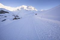 Straight Down the Road: Alps Under Clear Sky