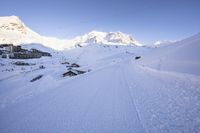 Straight Down the Road: Alps Under Clear Sky