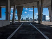 this looks like an under - bridge at a city in the us, with tall buildings and skyscrapers