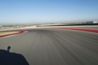 Straight Down the Road: Race Track in a Clear Sky