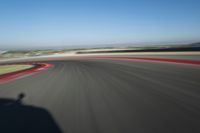 Straight Down the Road: Race Track in a Clear Sky