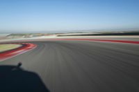 Straight Down the Road: Race Track in a Clear Sky