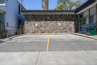 Straight Down the Road with Stone Wall in Suburban Toronto