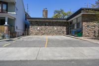 Straight Down the Road with Stone Wall in Suburban Toronto