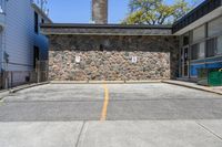 Straight Down the Road with Stone Wall in Suburban Toronto