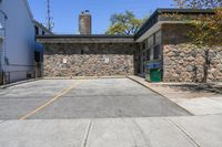 Straight Down the Road with Stone Wall in Suburban Toronto