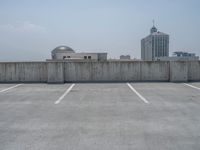 a parking lot and wall are pictured in a photo from the perspective point of view