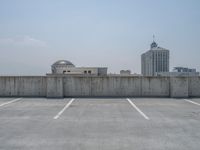 a parking lot and wall are pictured in a photo from the perspective point of view