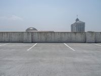 a parking lot and wall are pictured in a photo from the perspective point of view