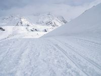 Straight Down the Road: A View of the Alps' Majestic Mountains