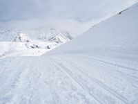 Straight Down the Road: A View of the Alps' Majestic Mountains